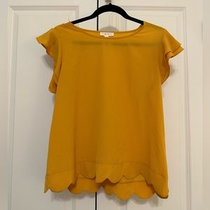 Scalloped bottom blouse
